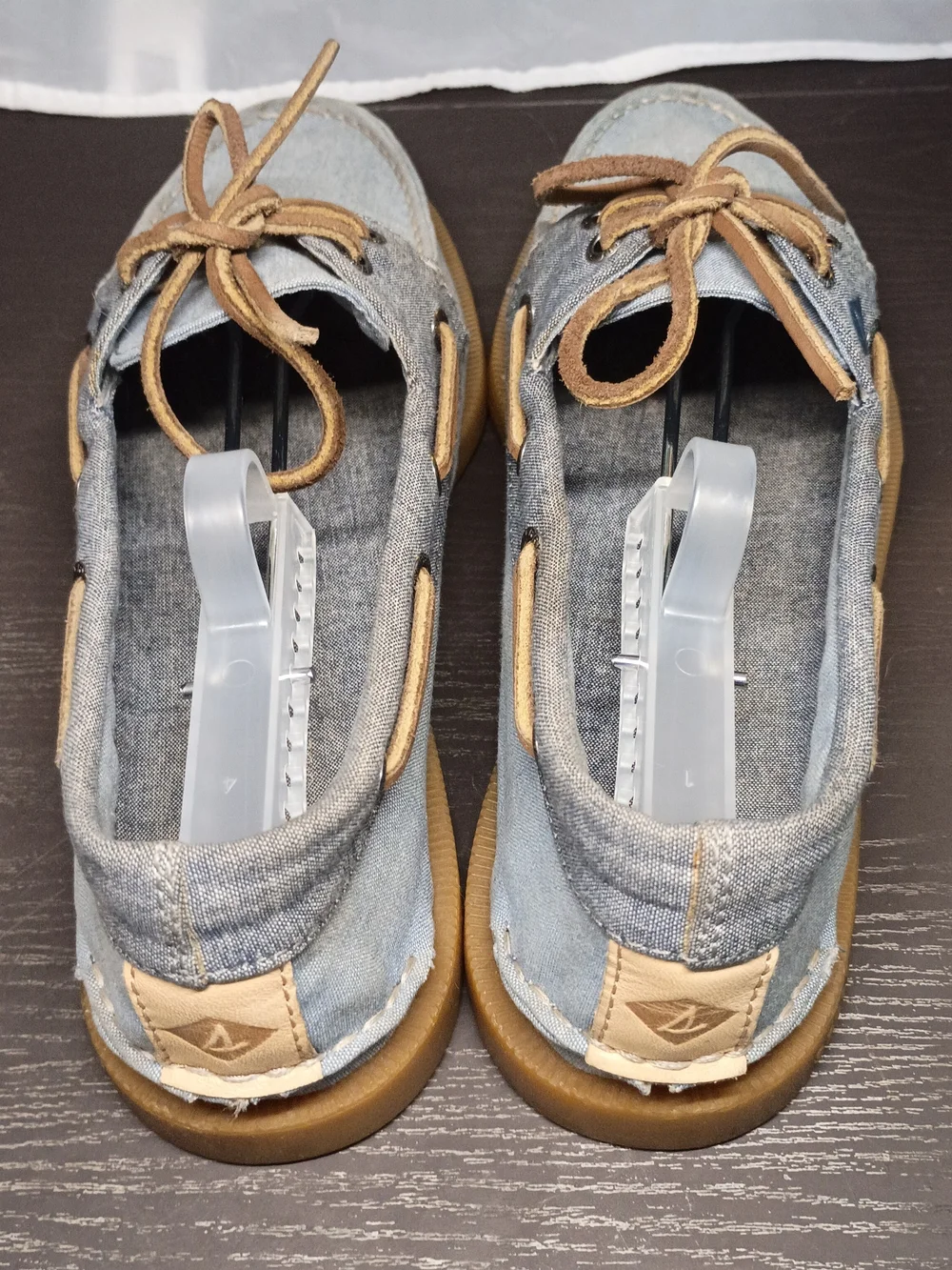 Sperry Men's 9.5M Powder Blue Canvas Boat Shoes with Tan Soles.